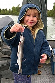 Child Holding Fish: Picture of Young Girl Holding Fish - Hooligan